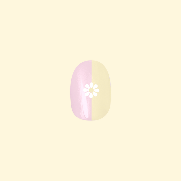Colorblock Daisy | Round | Short press-on with pink and pale yellow split and white daisy for easy at-home mani