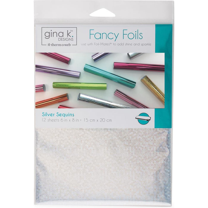 Gina K Designs - Fancy Foil 6"X8" - 12/Pkg - Silver Sequins. Add vibrant color and brilliant shine to any project! Can be used as a toner-reactive foil or a textile foil. This package contains twelve 6x8 inch pieces of foil. Made in USA. Available at Embellish Away located in Bowmanville Ontario Canada.