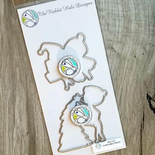 The Rabbit Hole Designs - Die Set - Love you More - Christmas Frost. The Rabbit Hole Designs dies are made of durable 100% steel Usable in nearly every machine on the market! Use on cardstock, felt, fabric or shrink plastic. You can use wafer thin dies to cut, stencil, emboss and create! Made in the USA. Coordinates with the Love you More - Christmas Frost 4x8 Stamp Set. Available at Embellish Away located in Bowmanville Ontario Canada.