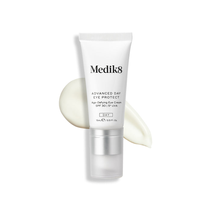 A tube of Medik8 Advanced Day Eye Protect with an SPF 30 rating, and a swatch behind it.