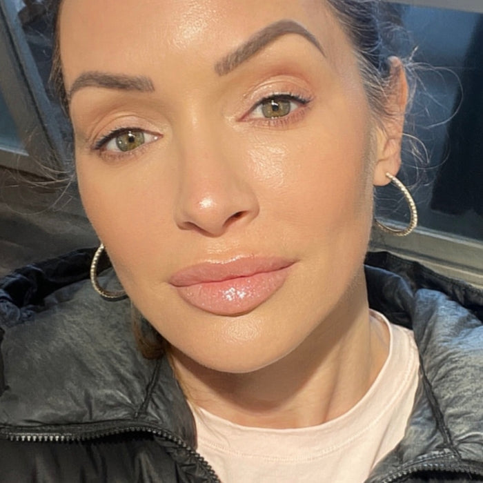 Patricia Hartmann wearing Runway Rogue Loaded Lip Oils in 'Angel Lights' an opalescent pale shimmer pink