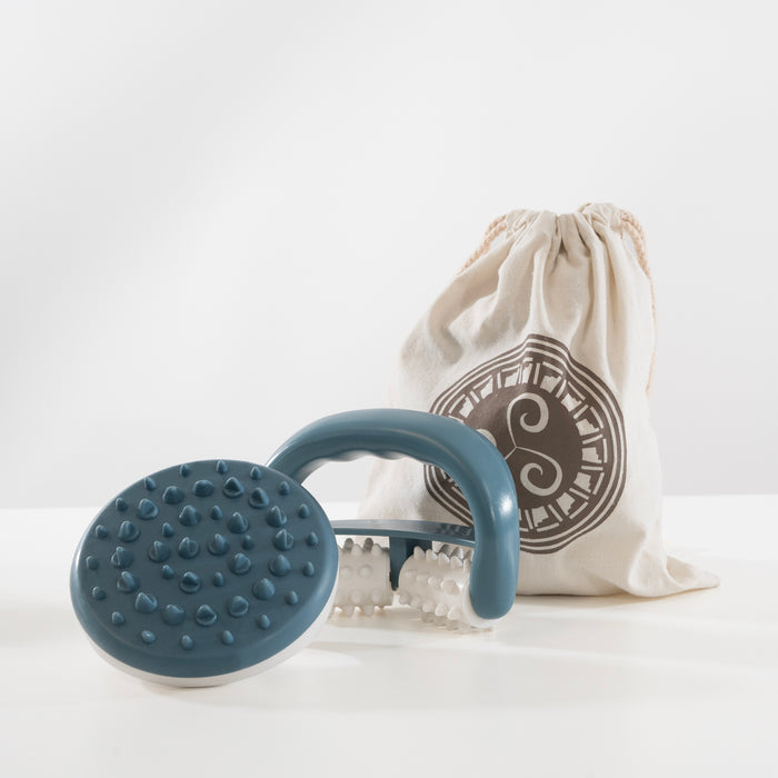 Blue and white dual-sided facial massage roller with textured nodules, paired with a natural cotton storage bag featuring a circular emblem design.