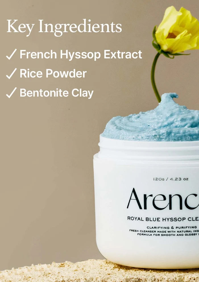 Jar of blue cream with a yellow flower on a beige background, featuring key ingredients text.