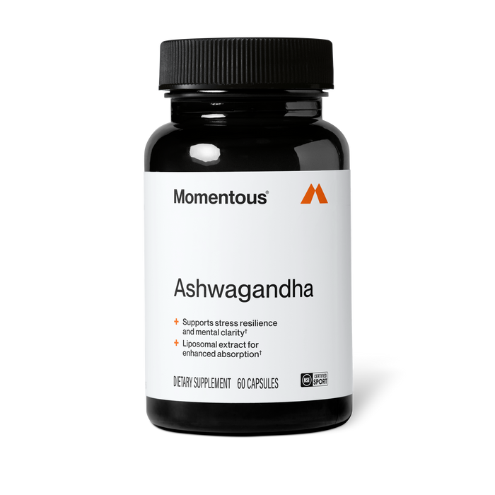 Black bottle of Momentous Ashwagandha dietary supplement, 60 capsules, NSF Certified for Sport, on a black background