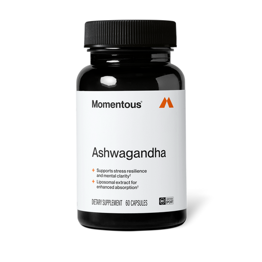 Black bottle of Momentous Ashwagandha dietary supplement, 60 capsules, NSF Certified for Sport, on a black background