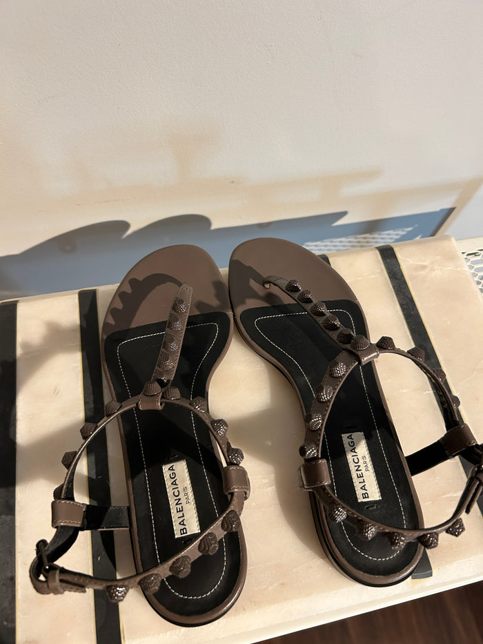 Balenciaga Arena sandals in size 35.5, featuring sleek black leather straps and chunky rubber soles for a modern look.