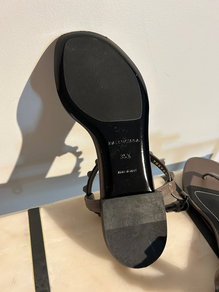 Balenciaga Arena sandals in size 35.5, featuring sleek design and premium materials, displayed on a neutral background.