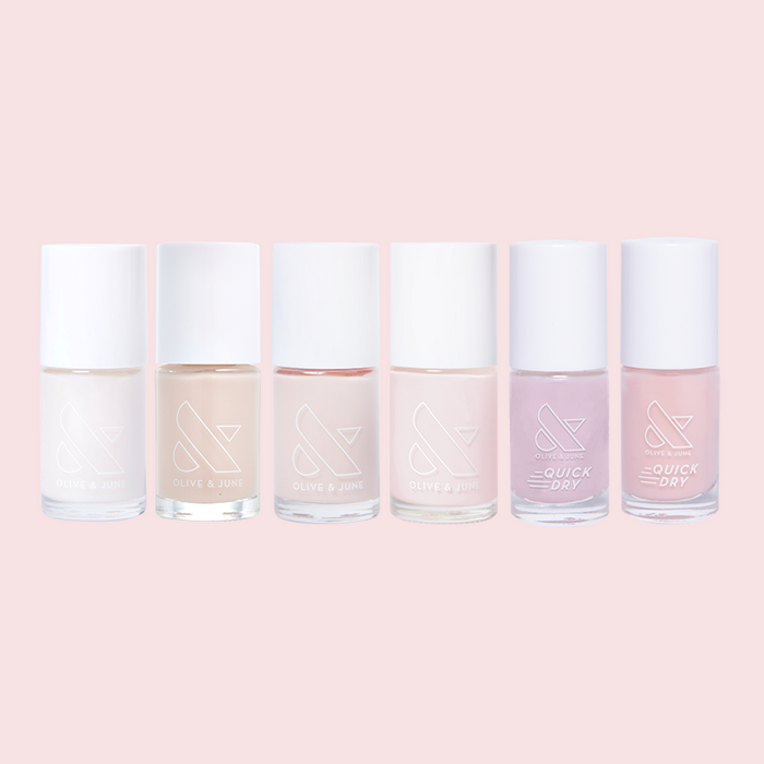 Bare Nail Set featuring six sheer neutral and subtle shimmer nail polishes by Olive and June on pink background
