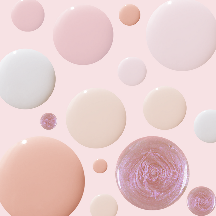 Bare Nail Set featuring sheer neutral and soft shimmer nail polish drops on light pink background for at-home mani