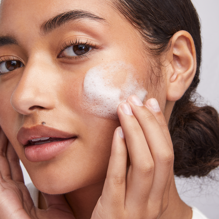 woman washing face using Barrier Pro™ 1-Step Cleanser || all