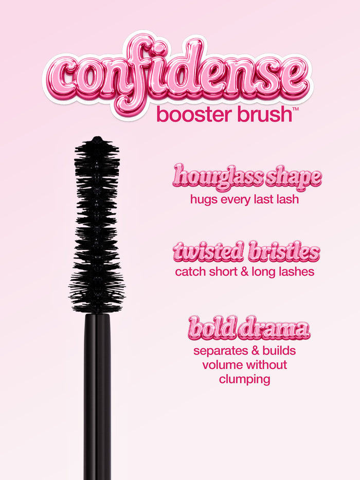 A pink tube of Tarte Cosmetics mascara labeled Big Ego with an attached brush is displayed against a white background. Text highlights ingredients: vitamin b5 moisturizes lashes, glycerin hydrates and conditions, babassu nourishes lashes, sunflower seed wax moisturizes.