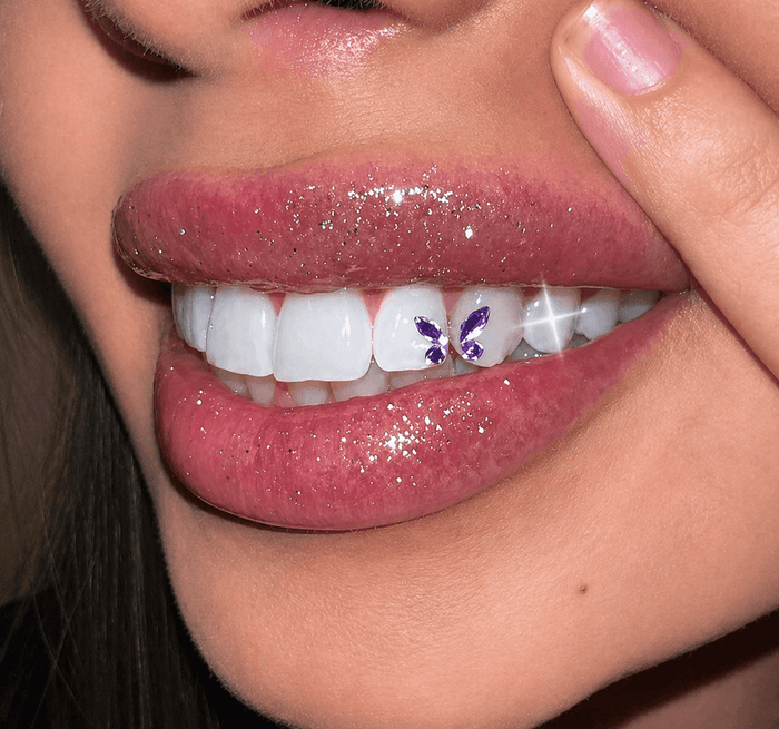 Close-up smile with clear butterfly tooth gem