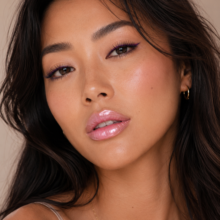 close-up of a woman wearing Runway Rogue LuxGloss in the shade Catwalk