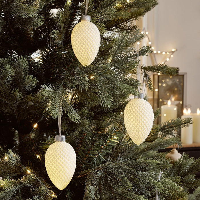 LL21106_Ceramic-Pinecone-LED-Christmas-Bauble-Trio-Hung-On-Christmas-Tree.jpg