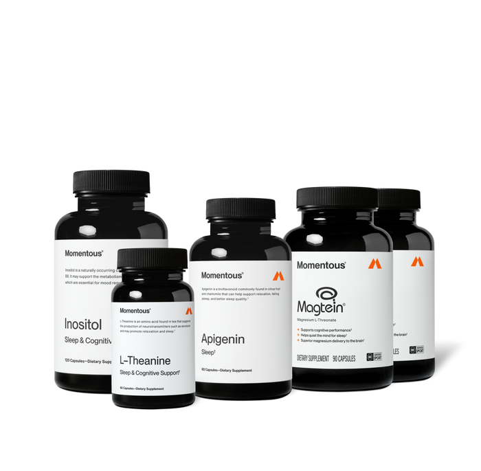 Group product shot of five Momentous dark amber supplement bottles with black caps. Labels read: "Inositol, Sleep & Cognitive [Support], 120 Capsules"; "L-Theanine, Sleep & Cognitive Support, 60 Capsules"; "Apigenin, Sleep, 60 Capsules"; and two "Magtein, Magnesium L-Threonate" bottles with claims "Supports cognitive performance," "Helps quiet the mind for sleep," "Superior magnesium delivery to the brain," 90 Capsules, NSF Certified Sport.