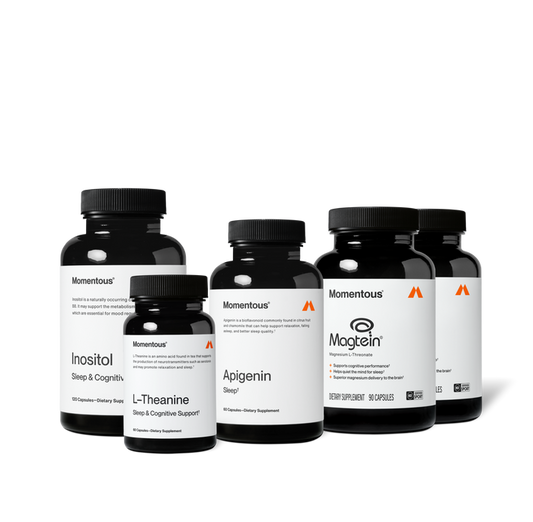 Group product shot of five Momentous dark amber supplement bottles with black caps. Labels read: "Inositol, Sleep & Cognitive [Support], 120 Capsules"; "L-Theanine, Sleep & Cognitive Support, 60 Capsules"; "Apigenin, Sleep, 60 Capsules"; and two "Magtein, Magnesium L-Threonate" bottles with claims "Supports cognitive performance," "Helps quiet the mind for sleep," "Superior magnesium delivery to the brain," 90 Capsules, NSF Certified Sport.