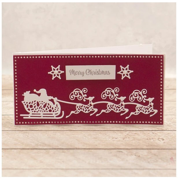Couture Creations - Tall Card Nesting Die Set - Santa's Sleigh - (5pc). This Happy Holiday and Christmas themed nesting die set contains a variety of complementary elements designed to work with tall cards. Mix and match to create unique and gorgeous cards this holiday season and all year round. Approximately 95 x 200mm | 3.7 x 7.8in. Available at Embellish Away located in Bowmanville Ontario Canada. Card example by brand ambassador.