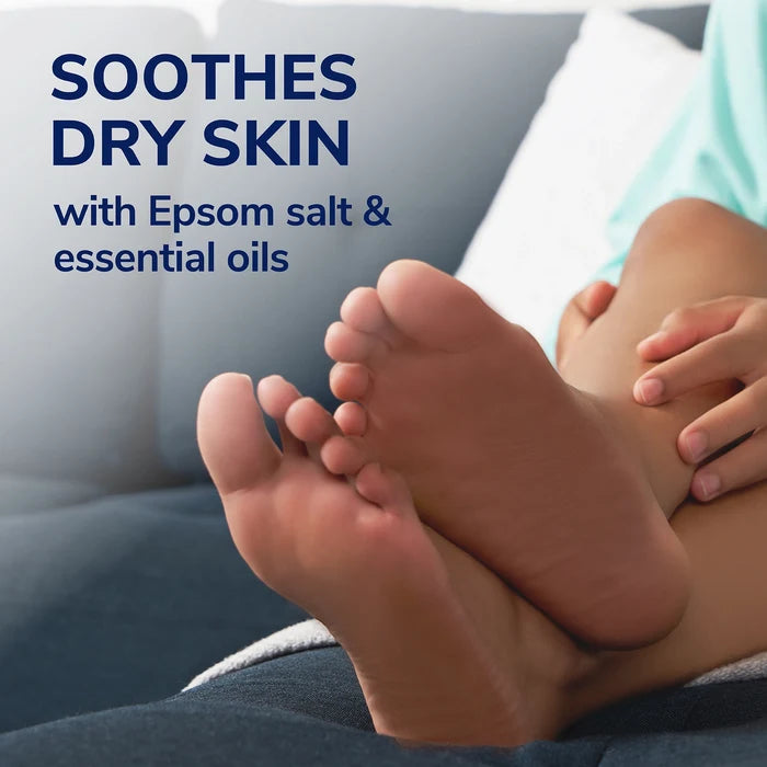 Foot lotion applied to bare feet on a couch, soothing dry skin
