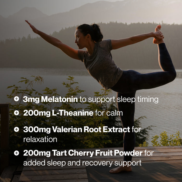 Woman performing a yoga pose outdoors near water and mountains. Text reads: “3mg Melatonin to support sleep timing,” “200mg L-Theanine for calm,” “300mg Valerian Root Extract for relaxation,” and “200mg Tart Cherry Fruit Powder for added sleep and recovery support.”
