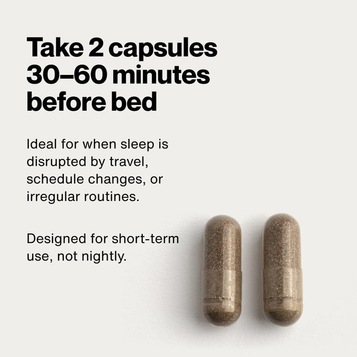 Two capsules on a white background. Text reads: “Take 2 capsules 30–60 minutes before bed.” Additional text reads: “Ideal for when sleep is disrupted by travel, schedule changes, or irregular routines.” “Designed for short-term use, not nightly.”