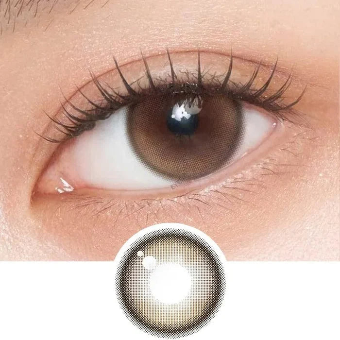 A close-up of a brown eye wearing Gemhour Demeter 1-Day 13.5 Amber Brown (10pk) color contacts by Gemhour; below, a separate image displays the lens design.