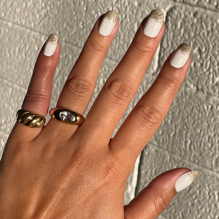 Glitter Gradient | Round | Short press-on nails with white base and gold glitter tips for a quick at-home mani