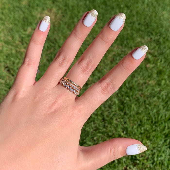 Glitter Gradient | Round | Short press-on manicure with white base and shimmering gold tips for easy at-home mani