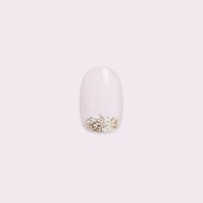 Half Moon Glitter Gradient | Round | Short press-on nail with subtle gold glitter at the tip for an easy at-home mani