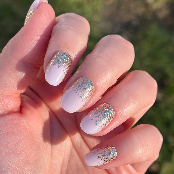 Half Moon Glitter Gradient | Round | Short press-on nails with a sparkling gold and silver glitter fade for a stylish at-home mani