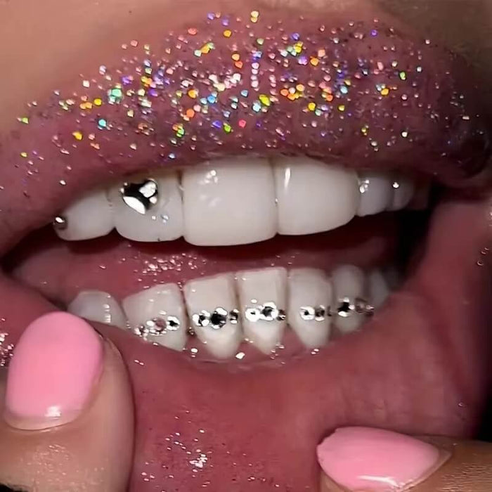 Close-up of LaserGlow heart-shaped tooth gem sparkling on a canine tooth, showcasing enamel-saf.