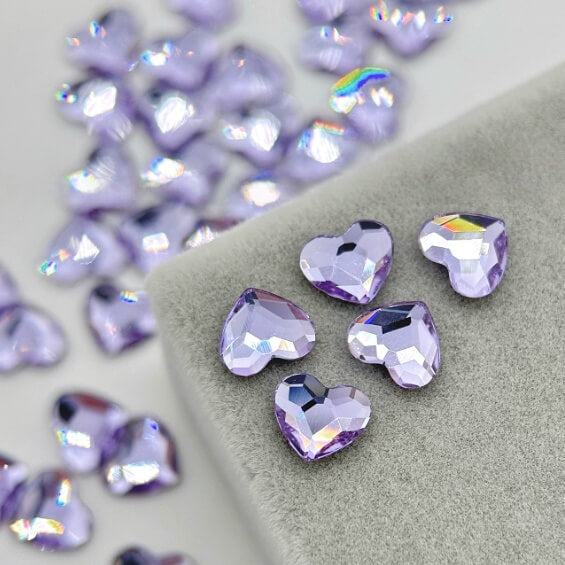 Lavender purple heart tooth gems with high-shine crystal sparkle for professional tooth jewelry application by LaserGlow