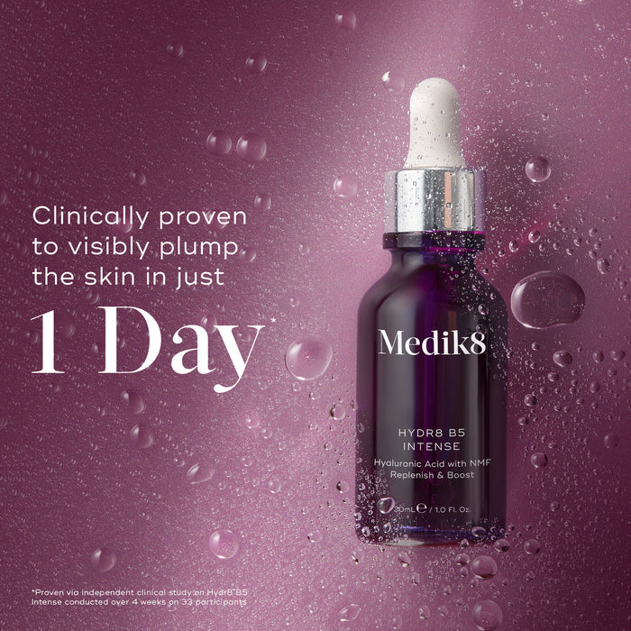 Medik8 Hydr8 B5 Intense glass dropper bottle centered on a shimmering purple background with translucent water droplets. Bold text states the product is clinically proven to visibly plump the skin in just 1 Day.