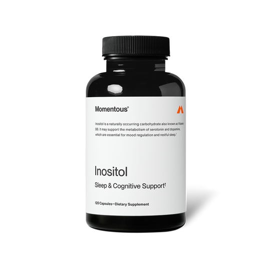 Black bottle of Momentous Inositol on a black background. Label reads: “Momentous,” “Inositol is a naturally occurring carbohydrate also known as Vitamin B8. It may support the metabolism of serotonin and dopamine, which are essential for mood regulation and restful sleep†.” Product name reads: “Inositol,” “Sleep & Cognitive Support†,” and “120 Capsules—Dietary Supplement.”