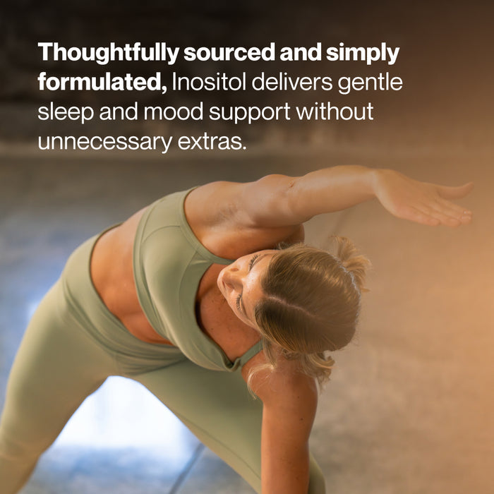 Woman stretching in an indoor setting with warm lighting. Text reads: “Thoughtfully sourced and simply formulated, Inositol delivers gentle sleep and mood support without unnecessary extras.”
