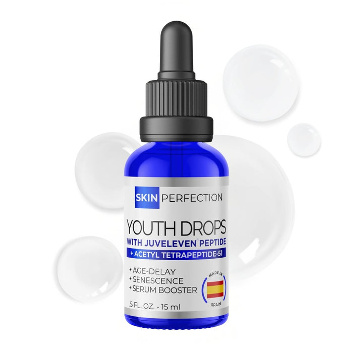 Bottle of Skin Perfection Youth Drops with Juvelieve Peptide on a white background with opaque droplets