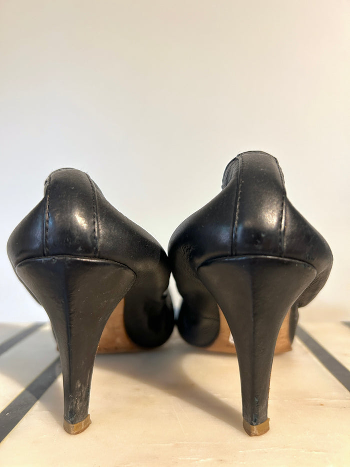 Lanvin leather pumps in size 8.5, stylish women's shoes with sleek design and pointed toe, perfect for elegant occasions.