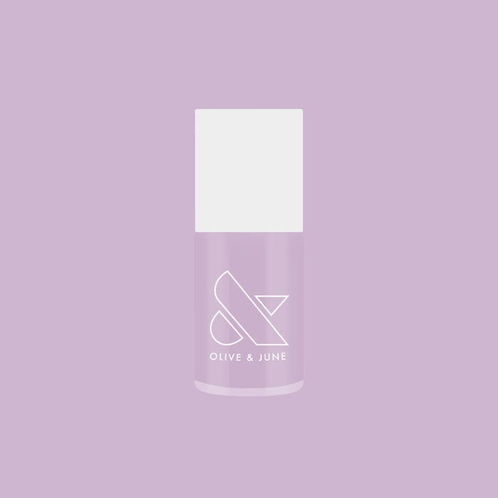 Bottle of Lavender Stems gel polish by Olive and June on a lavender background for at-home manicures