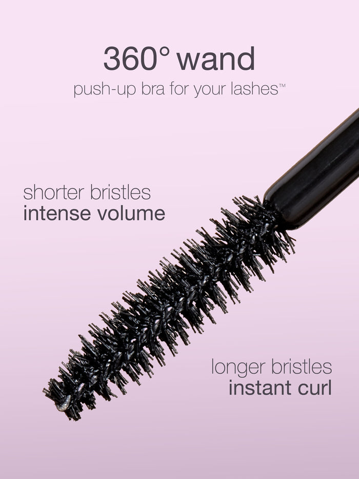 mascara wand with bristles on a pink background