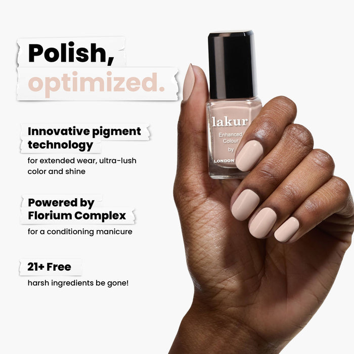 A hand displays LONDONTOWN's Linen nail polish, highlighting innovative pigment technology with a breezy, natural allure. This formula, powered by Florium Complex, is 21+ free of harsh ingredients.