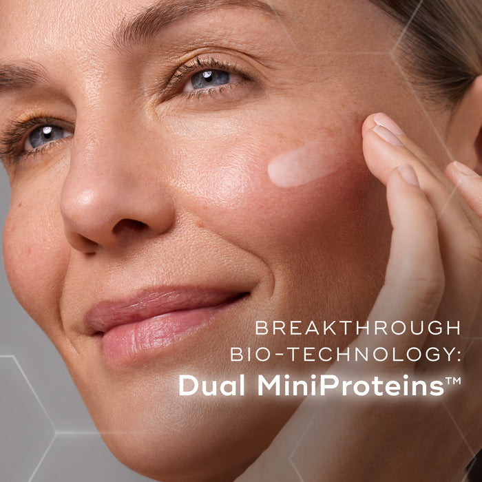 A woman is shown applying liquid peptides advanced MP to  the cheek. Text overlays the image, highlighting "BREAKTHROUGH BIO-TECHNOLOGY: Dual MiniProteins™.