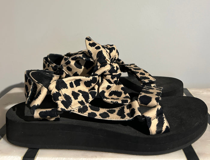 Loeffler Randall animal print sandals in size 7.5, stylish open-toe shoes with bold animal pattern and ankle straps.