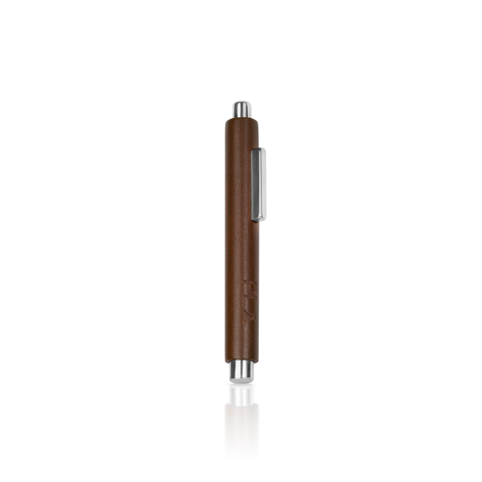 Brown pen with silver clip on a white background for cat eye art designs
