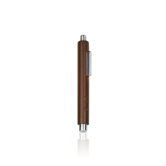 Brown pen with silver clip on a white background for cat eye art designs