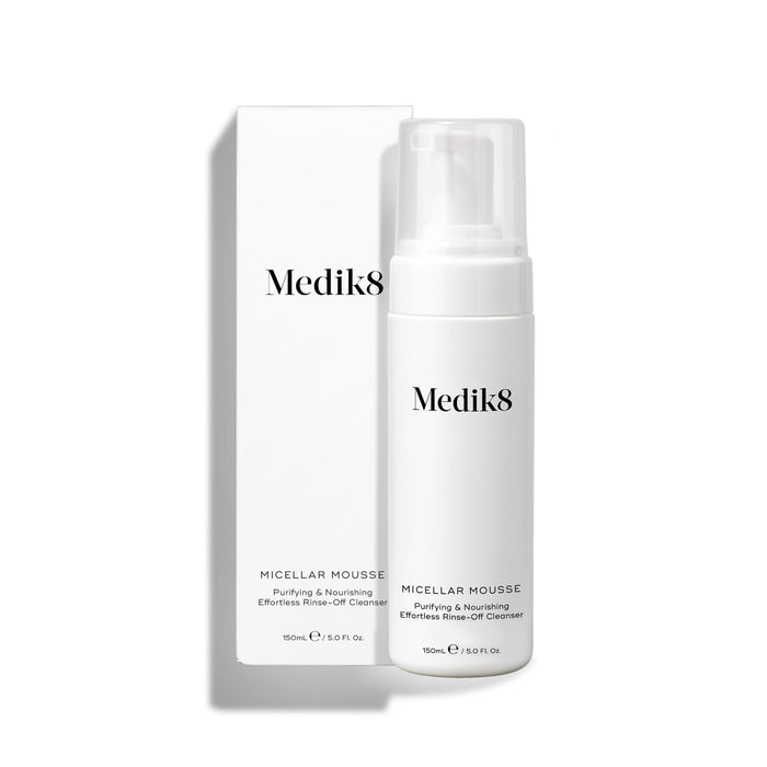 Medik8 Micellar Mousse pump bottle standing next to its white packaging box on a white background. Text identifies it as a "Purifying & Nourishing Effortless Rinse-Off Cleanser."