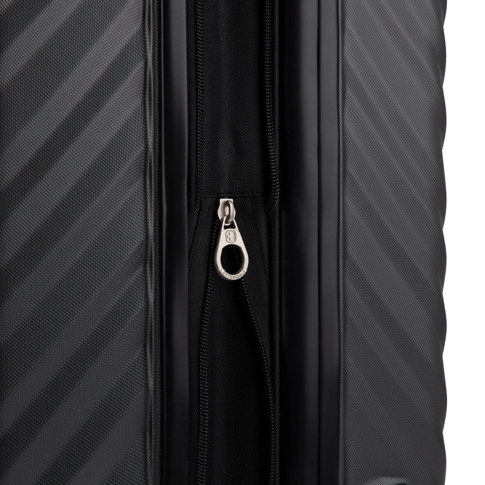 Close up view of a luggage called MOD designed by Swiss Gear sold at Bentley, showcasing its zipper pull tab with the logo.