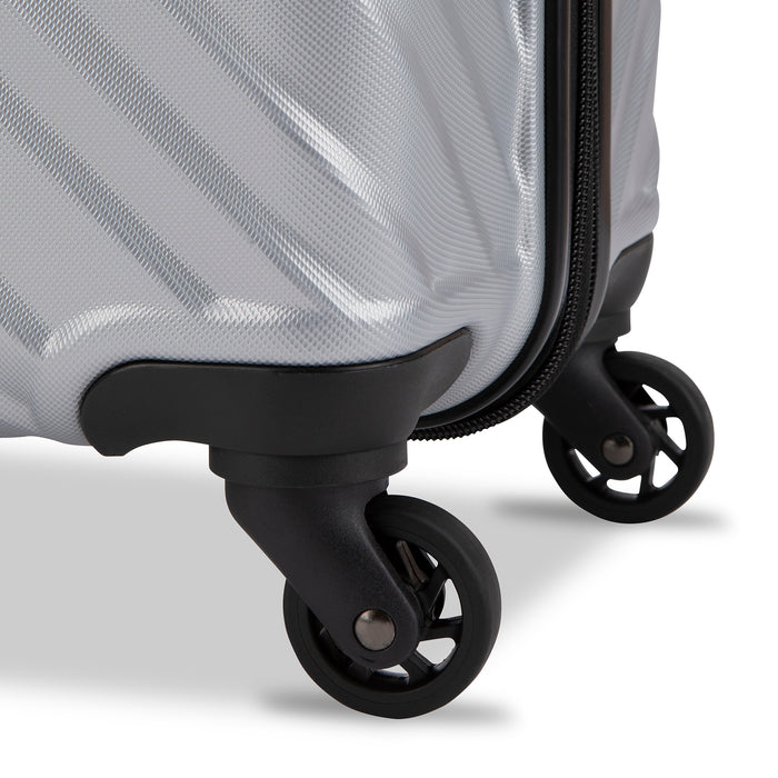 Close up view of a luggage called MOD designed by Swiss Gear sold at Bentley, showcasing 2 of its 4 spinner wheels.