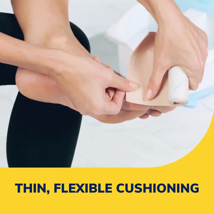 Padding roll sheet being pressed onto a foot for cushioning and protection