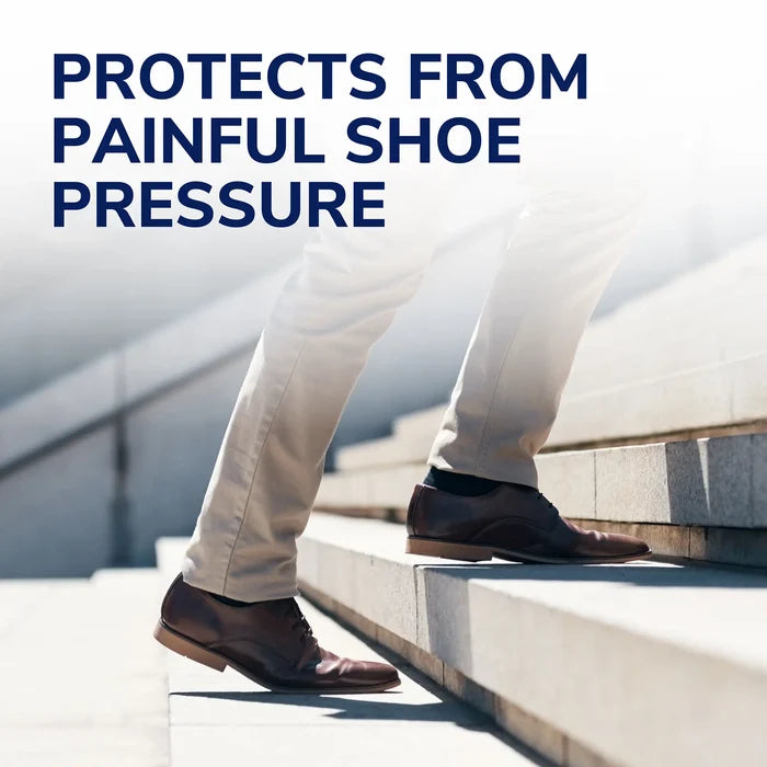 Cushioned shoe support pad on a foot stepping on stairs