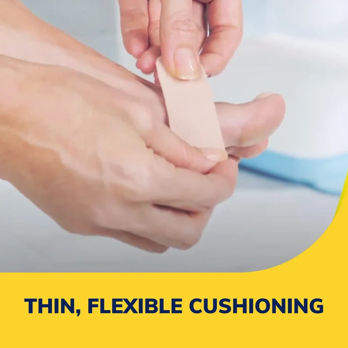 Moleskin padding strip being applied to a foot for thin, flexible cushioning