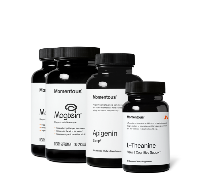 Group product shot of four Momentous dark amber supplement bottles with black caps. Labels read: two "Magtein, Magnesium L-Threonate" bottles with claims "Supports cognitive performance," "Helps quiet the mind for sleep," "Superior magnesium delivery to the brain," 90 Capsules; "Apigenin, Sleep, 60 Capsules"; and "L-Theanine, Sleep & Cognitive Support, 60 Capsules."